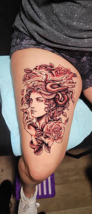 Black and grey illustrative Medusa tattoo designed and tattooed by Belleview tattoo artist Chelsea at Stranger Flowers Yet Tattoo