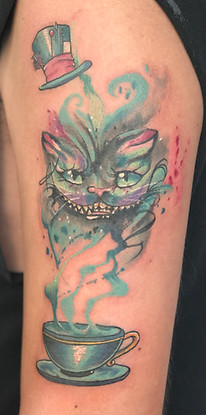 Watercolor Alice in Wonderland tattoo designed and tattooed by Gregg