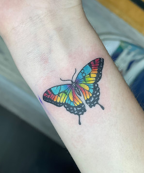 Butterfly tattoo designed and tattooed by Breanna