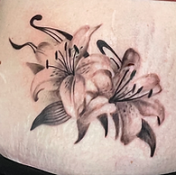 Black and grey realism tattoo. Lily custom tattoo designed and tattooed by ocala florida tattoo artist Gregg at The tattoo Gallery of Ocala, LLC