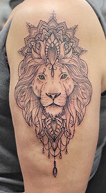 black and grey lion mandala tattoo
