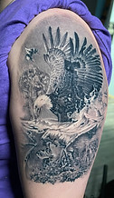 Black and grey realism bald eagle hunting wildlife scene tattoo designed and tattooed by Ocala Florida tattoo artist Gregg