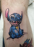 Stitch cartoon tattoo designed and tattooed by Ocala tattoo artist Aubrey Quinn at The Tattoo Gallery of Ocala in Ocala Florida