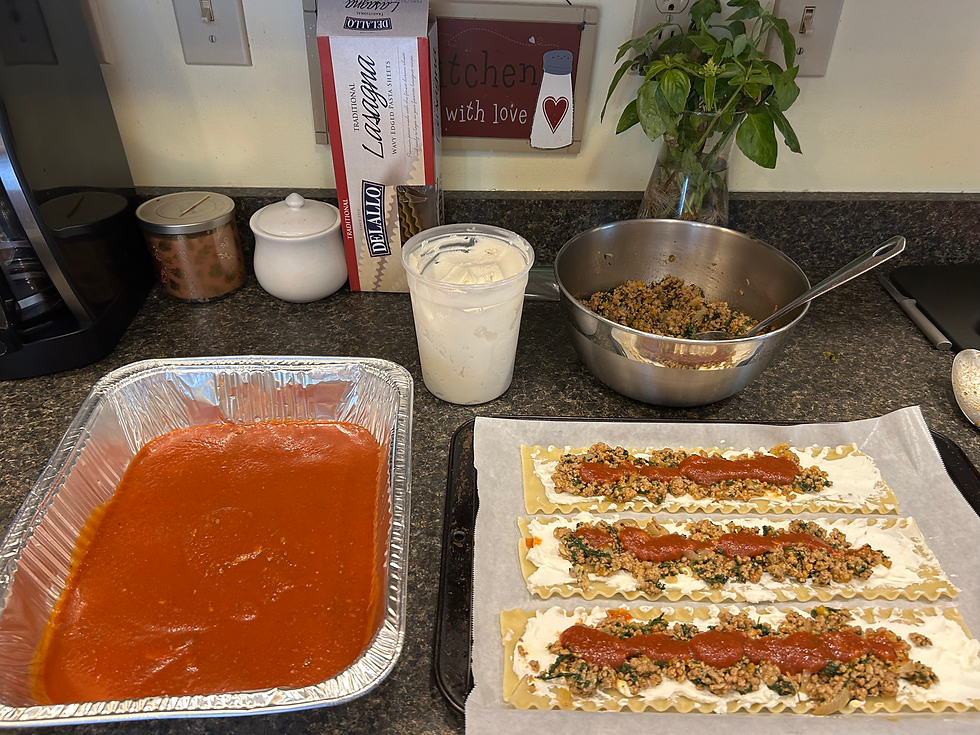 Add a thin layer of prepared tomato sauce, keeping it minimal to prevent difficulty when rolling into pinwheel.