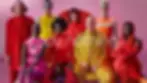 Eight people wearing bright clothes
