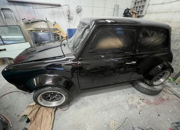 Restored classic Mini with glossy red paintwork
