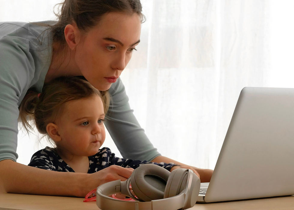 Lady and daughter looking at a laptop