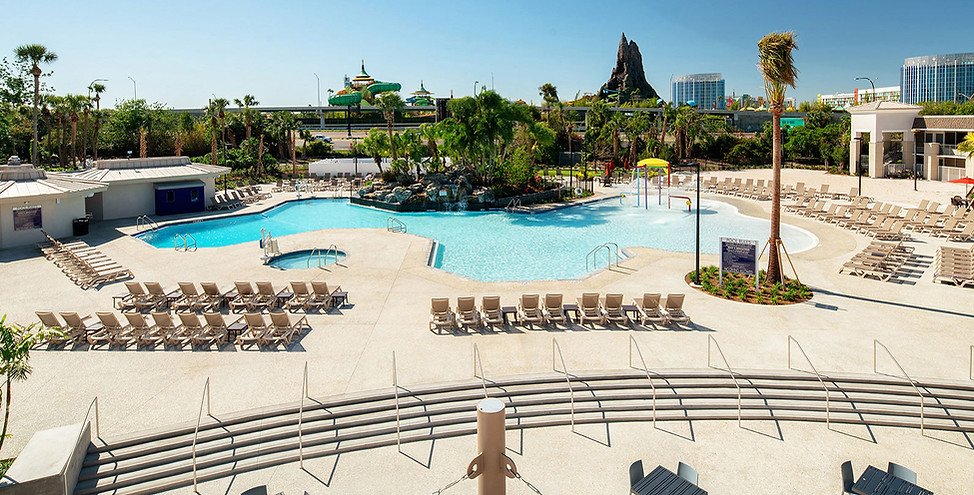 Wyndham I-Drive Avanti Resort pool complex with Volcano Bay on the background