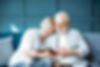 An elderly couple look at their financial plan