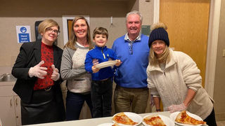 Foundation members delivering pizza during exams