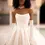 Thumbnail: A bride standing tall in the stunning Odette by WONA Concept gown, the embodiment of sophisticated bridal glamour.