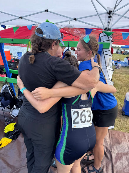 SCAR athletes celebrate with a hug after a race or team event.