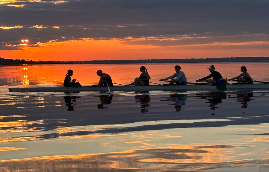 Seminole County Area Rowing athletes train on Lake Jesup during a stunning Florida sunset, where calm water and colorful skies create ideal rowing conditions.