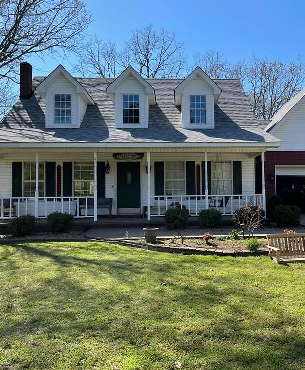 Elevate Roofing crew installing new residential roof on Arkansas home, professional roofing work