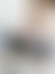 A woman's hand holding architectural finish samples