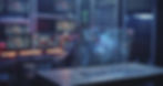 man sitting at a futuristic computer screen representing business management