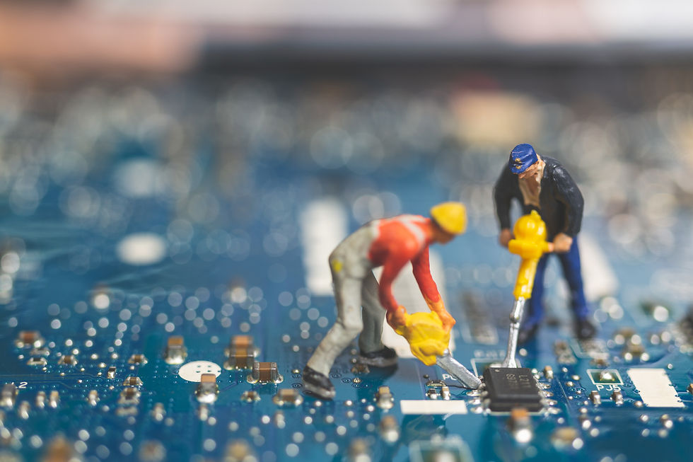 vecteezy_miniature-team-of-engineers-repairing-a-keyboard-computer_2135242.jpg
