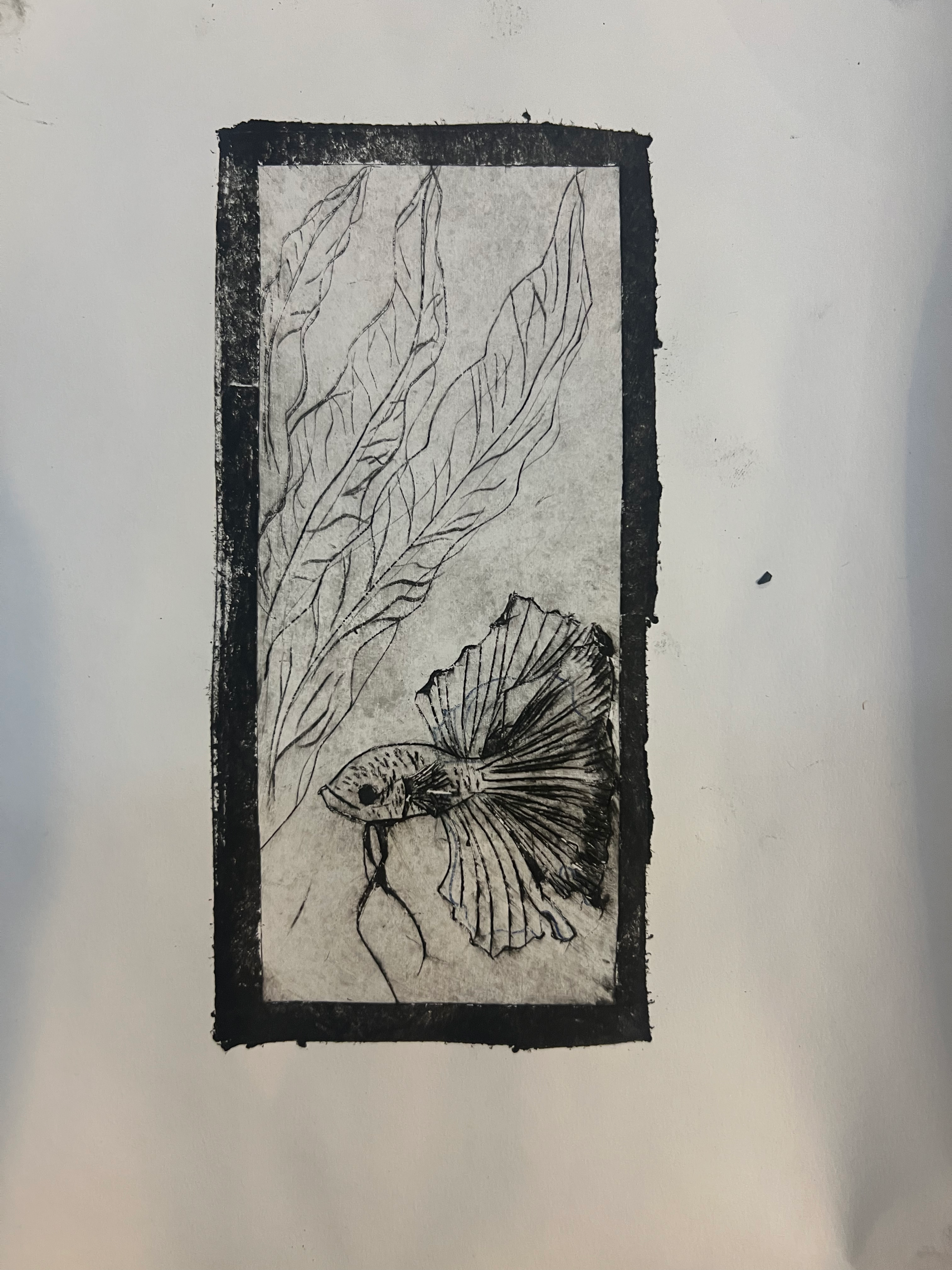 Tetra pak printing art class for adults, a beta fish image is carved into the recycled tetra pak