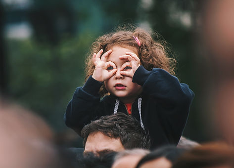 Young girl on the shoulders of of her dad