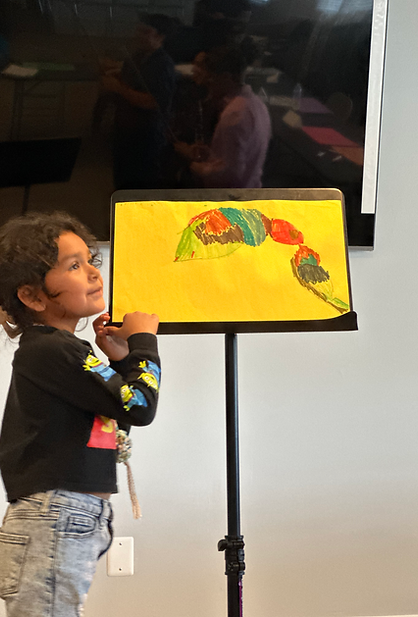 A young student excited to showcase her creative work