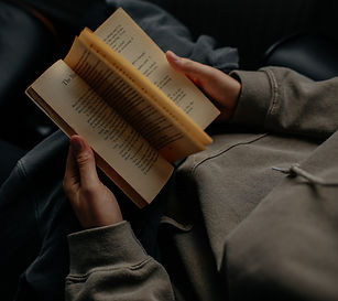 person%20reading%20book%20white%20sittin