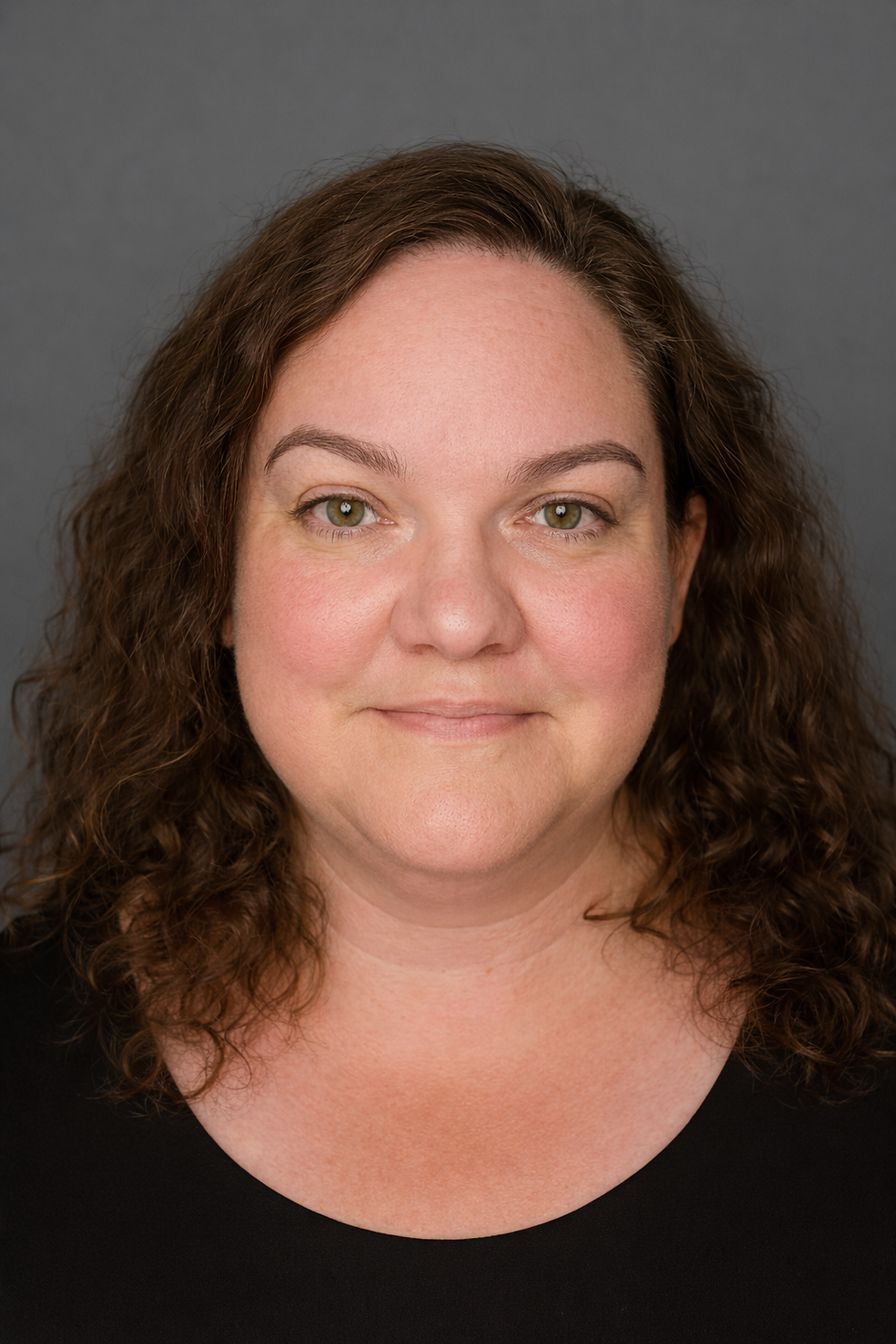 Jodi Harris, maker and founder of Sarcastic Narwhal Soap Co., photographed in a studio portrait.