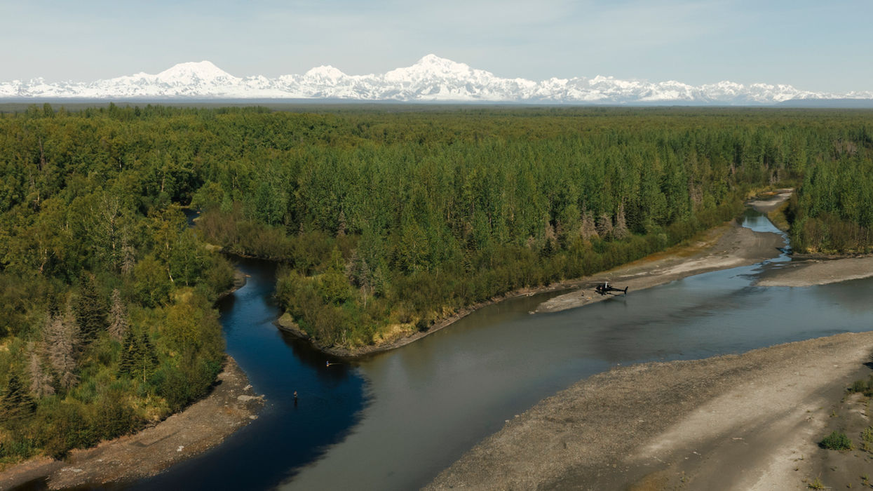 river in alaska with mountains in the background