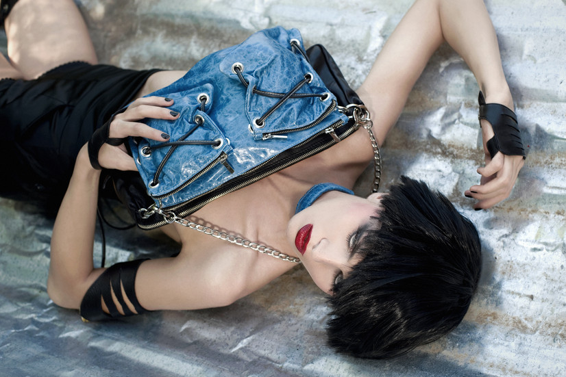 Model wearing a leather bag, gloves, neckless, and leather arm cuff from Dariya Repina’s leather collection during a Rome photoshoot styled by Carolina Turra.