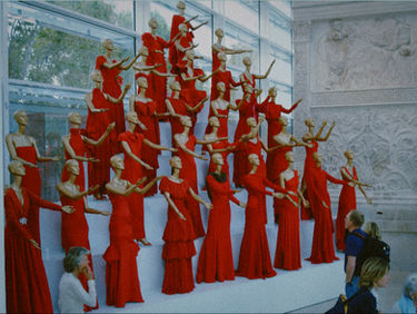 Display of Valentino’s iconic red gowns at the Valentino retrospective in Rome.