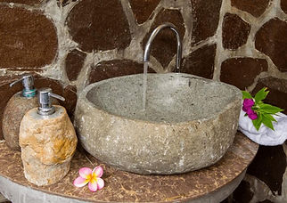 decorative marble basins. Natural stone sinks on vanity unit.