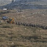 Security forces and heavy engineering equipment leaving Kumi Ori; Free use