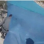 Border policeman filming the boys; Photo credit: Honenu