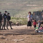 Residents attempting to construct tents; Photo credit: Avraham Shapira