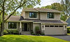 Minnetonka MN window installation on a 1990s two story home with new black replacement windows and updated curb appeal