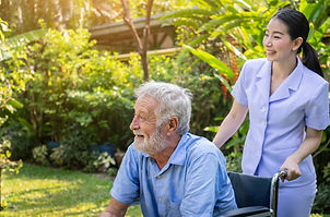 happy-nurse-take-care-elderly-man-wheelchair-garden-nursing-home.jpg