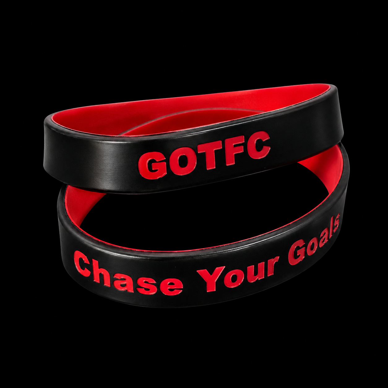 GOTFC wristbands with 'Chase Your Goals' text.