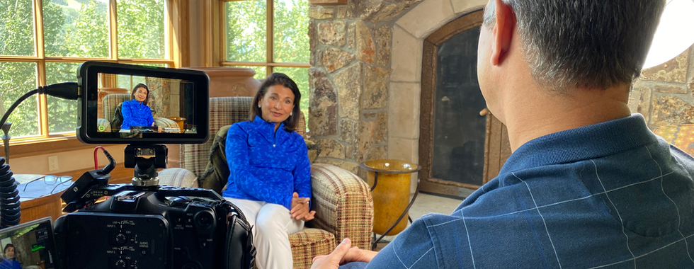 Neera Singh seated for an on-location interview during a Wireless History Foundation production.