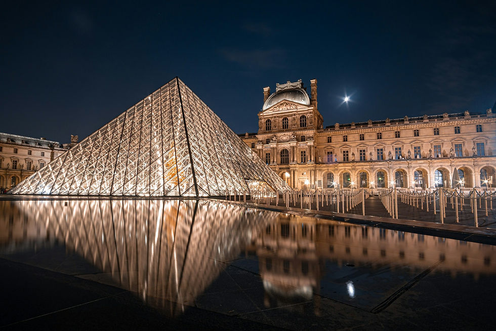 Illuminated Louvre Pyramid at night