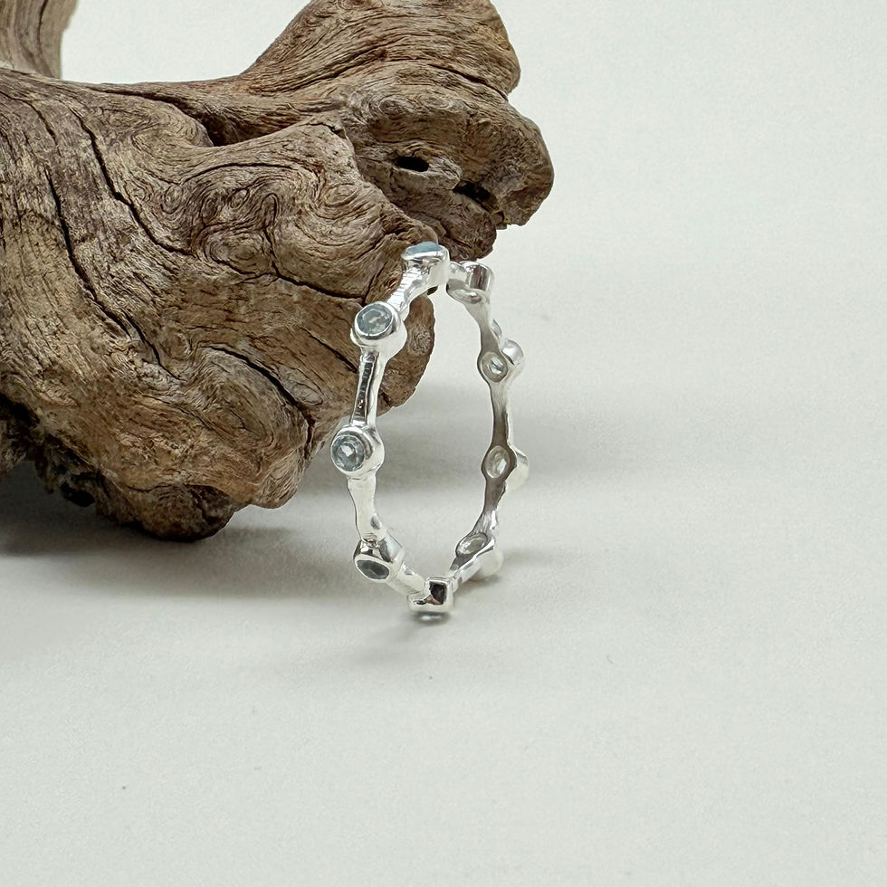 Blue Topaz Spaced Eternity Ring