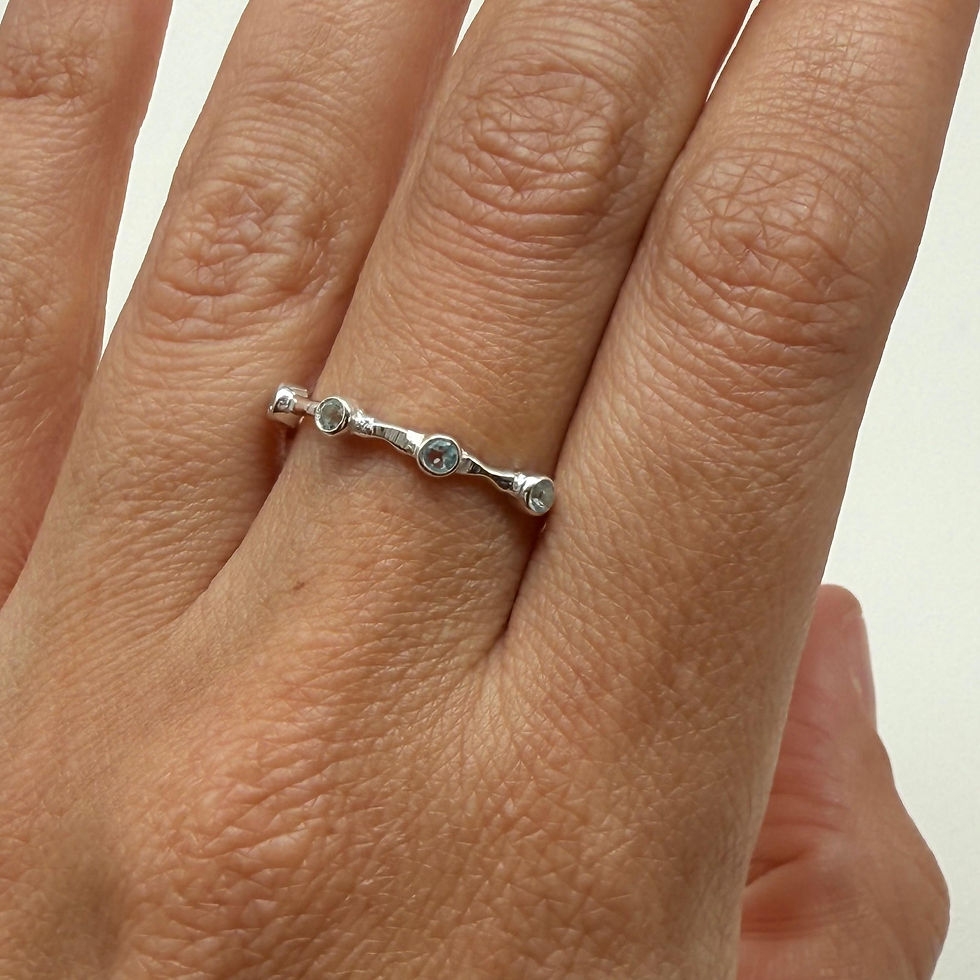 Blue Topaz Spaced Eternity Ring