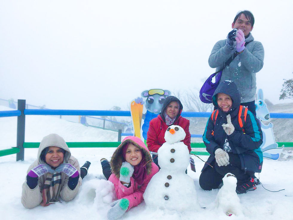 Building a snowman and playing in the snow at Mount Buller