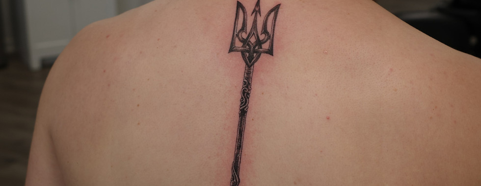 black and grey realism memorial Trident tattoo for his brother