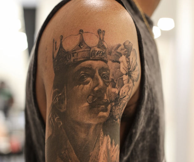 realism portrait tattoo of salvador dali on the upper arm
