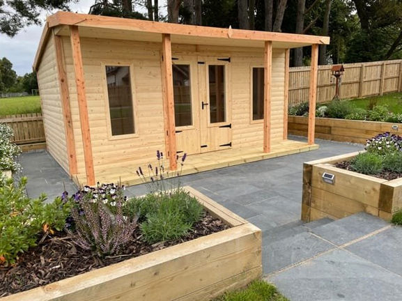 summerhouse with planters in front