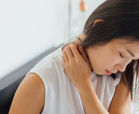 woman experiencing neck pain.jpg