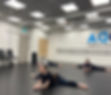 dancers performing splits in studio