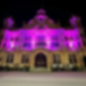 building lit with pink glow.jpg