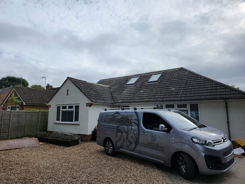 Spartan van outside bungalow