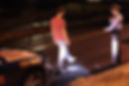 A Georgia State Patrol Trooper conducts standardized field sobriety tests (FSTs) on a suspected drunk driver on a public road at night.