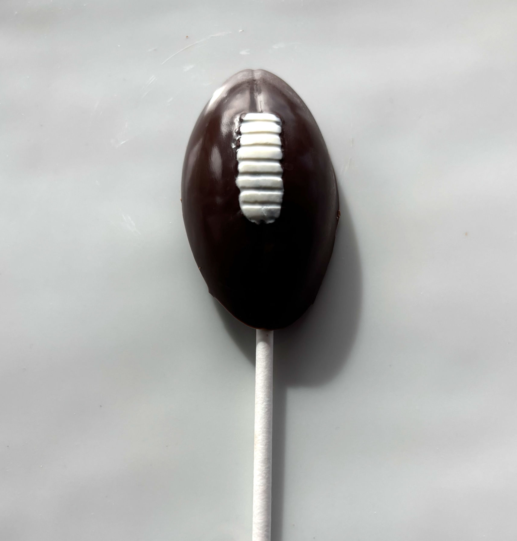 Chocolate Football Lollipops - 12 pcs.